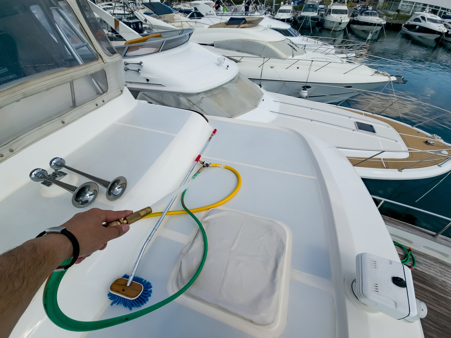 Professional Boat Cleaning Service At Luxury Marina Dock